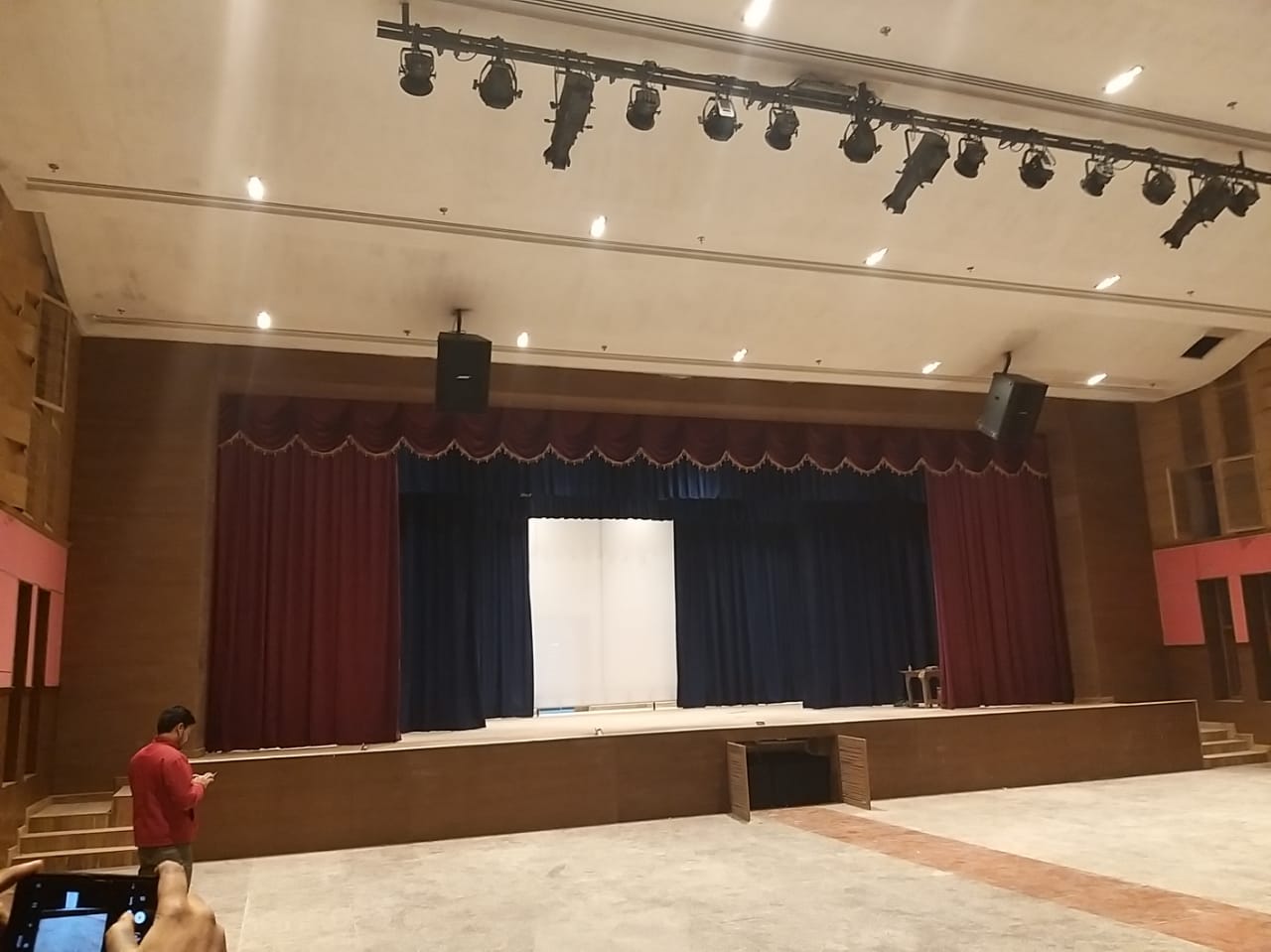 Commercial auditorium stage lighting and professional audio installation